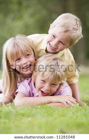 children playing. 3 children playing outside