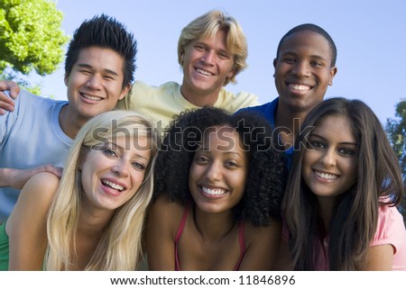 Group of six young friends having fun outside