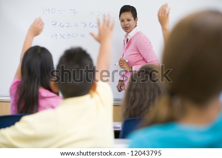 Elementary school maths class with teacher