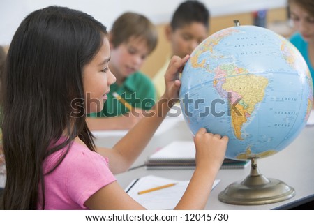 Elementary school geography class with globe