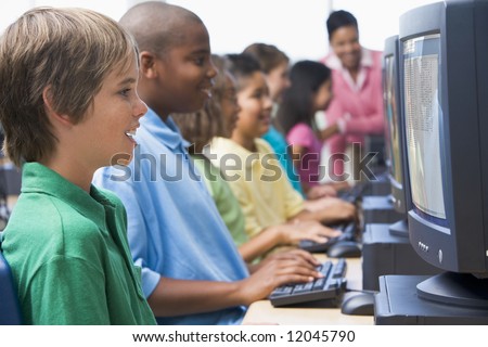 Male pupil in elementary school computer class