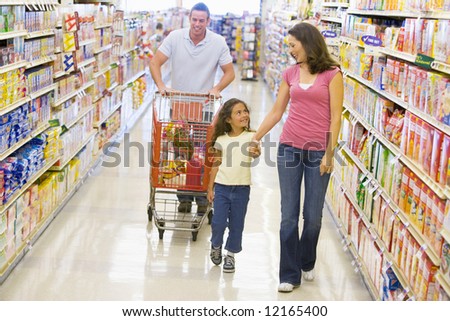 Family grocery shopping in supermarket