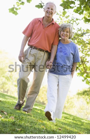 Senior couple on walk in countryside