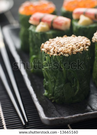 Dish of Rolled Spinach Three Ways-Snow Crab Toasted Sesame Seeds and salmon Roe