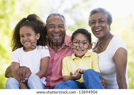 Grandparents laughing with grandchildren