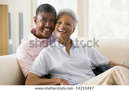 stock photo : Couple relaxing indoors and smiling