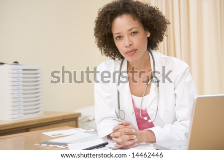 Doctor with laptop in doctor\'s office