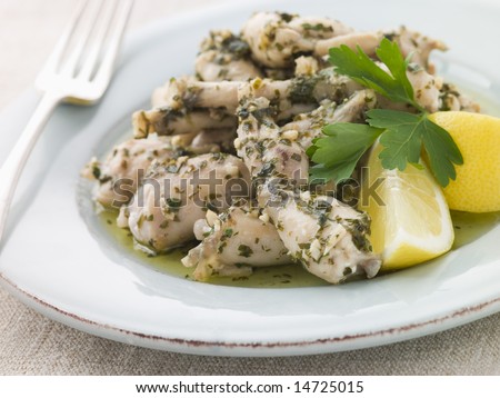 Frogs Legs Fried in Garlic and Herb Butter with Lemon