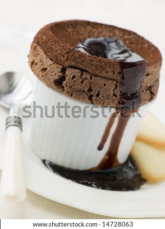 stock photo : Hot Chocolate Souffle with Chocolate sauce and Langue de Chat stock photo : Hot Chocolate Souffle with Chocolate sauce and Langue de Chat