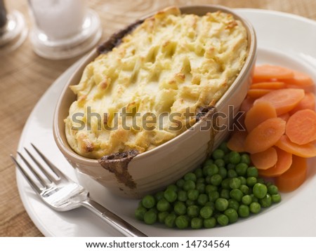 Individual Cottage Pie With Peas And Carrots Stock Photo 14734564 ... Individual Cottage Pie With Peas And Carrots Stock Photo 14734564 ...