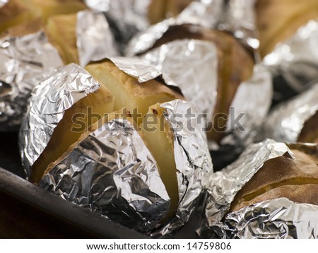 Tray of Jacket Potatoes Wrapped in Foil