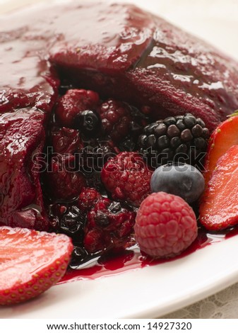 Traditional Summer Pudding with a scoop out