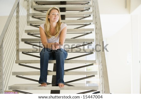 Woman sitting on stairs