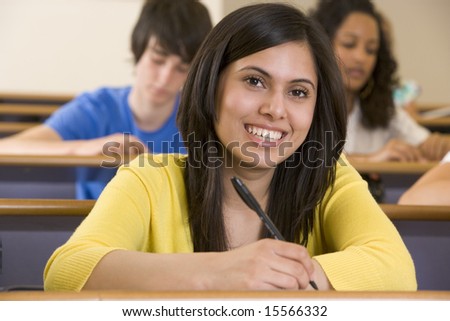 Female college student listening to a university lecture
