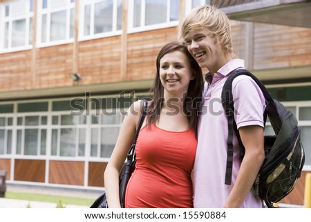Male and female college students on campus