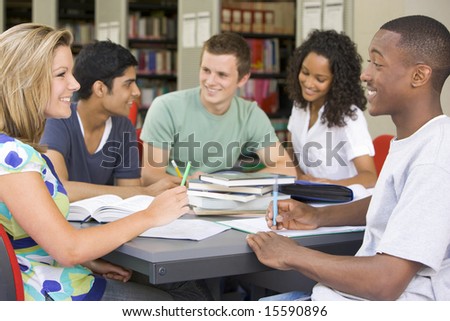 stock photo : College students studying together in a library