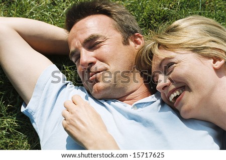stock photo : Couple lying outdoors smiling