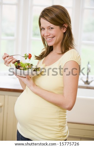pregnant lady eating. stock photo : Pregnant woman