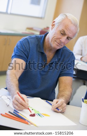 Mature male student in art class