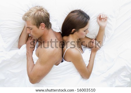 man and women in bed asleep