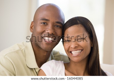 stock photo : Couple in living room smiling