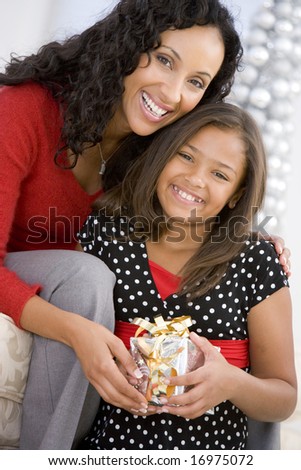 Mother Giving Daughter Her Christmas Present
