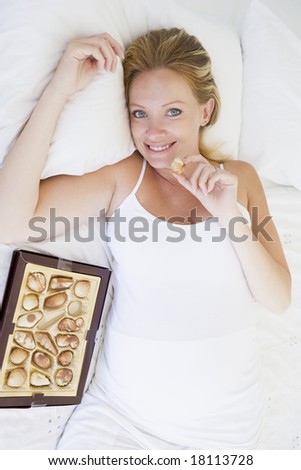 pregnant woman eating chocolates