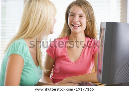 Teenage Girls Sitting On A Computer