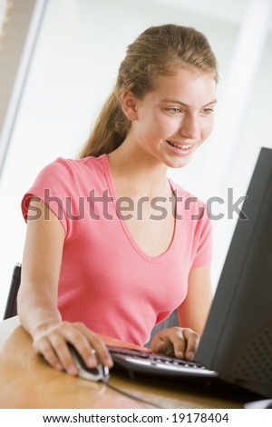 Teenage Girl Using A Computer