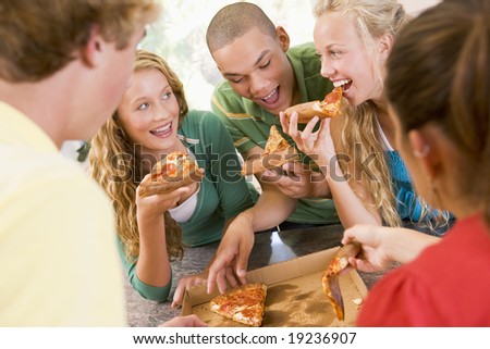 stock photo Teenagers Eating Pizza