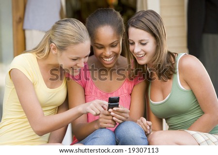 stock photo Teenage Girls Texting