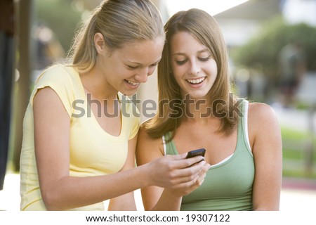 stock photo Teenage Girls Texting