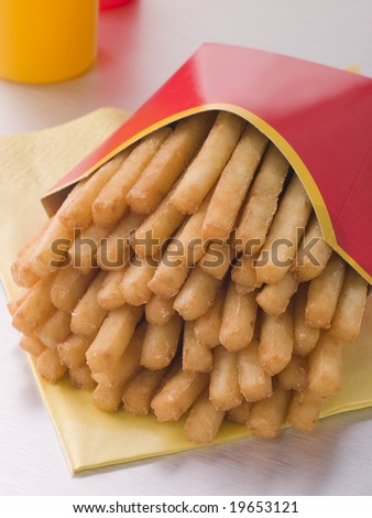 French Fries In A Box With Sauce Bottles