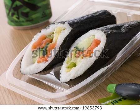 Hand Moulded Sushi With A Can Of Green Tea