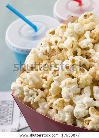 Bucket Of Popcorn With Soft Drinks And Cinema Tickets