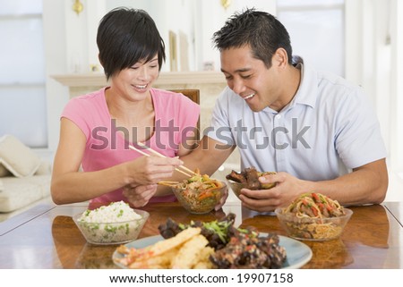 Young Couple Enjoying Chinese Food