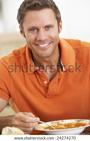 fat man eating grapes. stock photo : Middle Aged Man