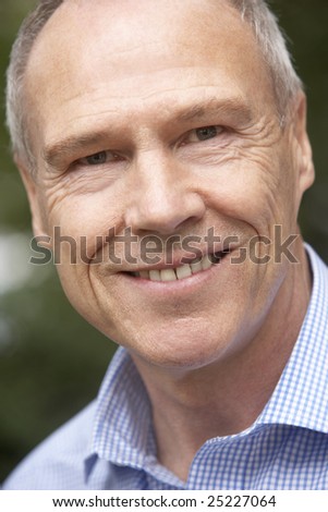 Portrait Of Middle Aged Man Smiling At The Camera