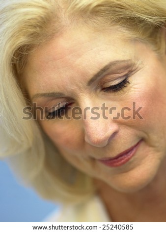 Portrait Of Senior Woman Looking Down
