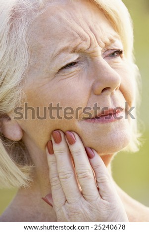 Portrait Of Senior Woman With A Toothache