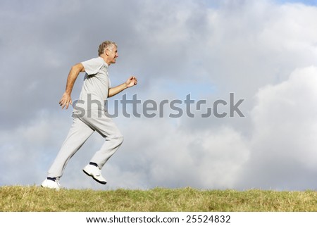 Senior Man Jogging In The Park