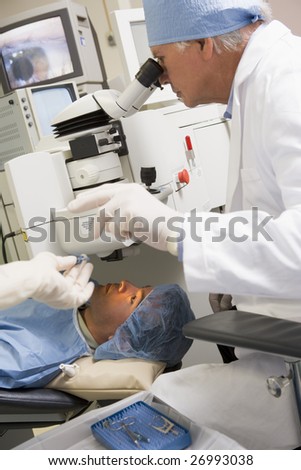 Doctor Performing Laser Eye Surgery on Patient\'s Eyes