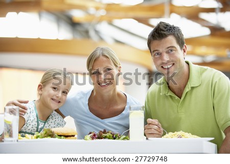 Family Having Lunch Together At The Mall