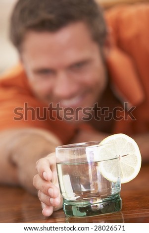 Man Having A Drink At Home
