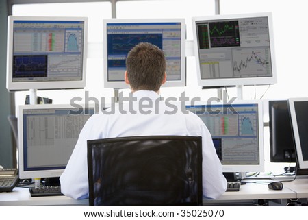 stock-photo-stock-trader-looking-at-multiple-monitors-35025070.jpg
