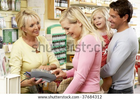 Female sales assistant in health food store