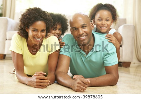 Family Relaxing At Home Together