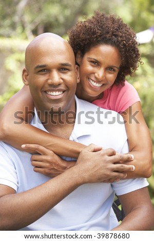 stock photo : Young Couple Outdoors Hugging