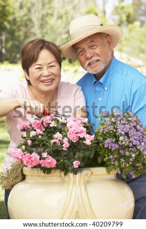 Senior Couple Gardening Together