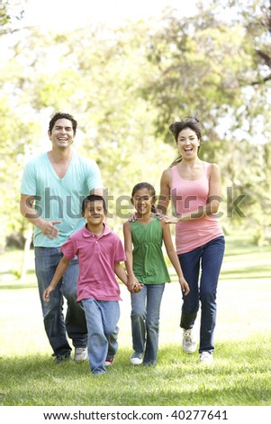 Young Family Having Fun In Park